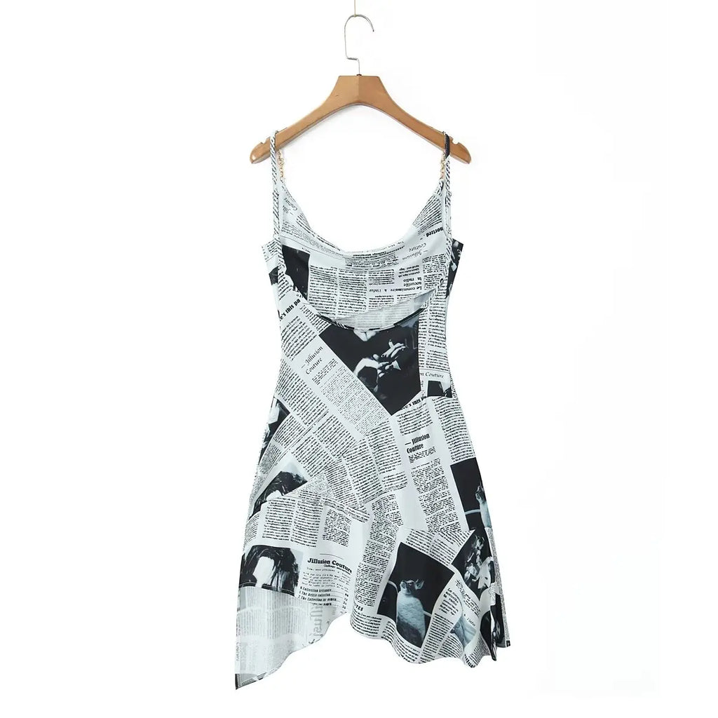 YENKYE New Women Newspaper Letter Print Irregular Hem Sling Dresses Fashion Backless Thin Straps With Chain Summer Sexy Dress