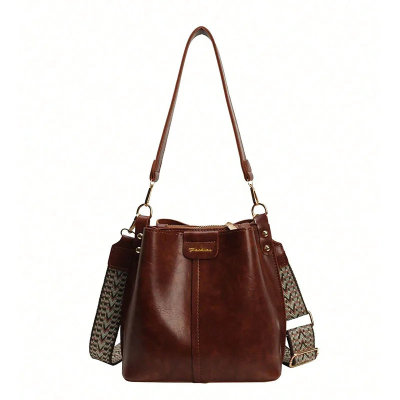 Exquisite women's bucket bag, fashionable and avant-garde solid color shoulder bag crossbody bag, retro and niche design, suitab
